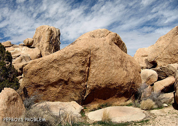 "Pepboys Problem" goes up the boulder crack, photo center.<br>
Photo by Blitzo.