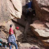 Aaron starting the first pitch of the West Overhang (6+).  After the first few move the route cruises into 5.4 through the slot directly to the right of the big block.