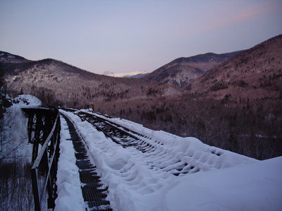 Just after sunset at Frankenstein. Amphitheater is to the left of the trestle. Mt. Washington can be seen in the back.