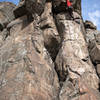 Below the roof and ready for the crux sequence on Major Bolt Achievement.