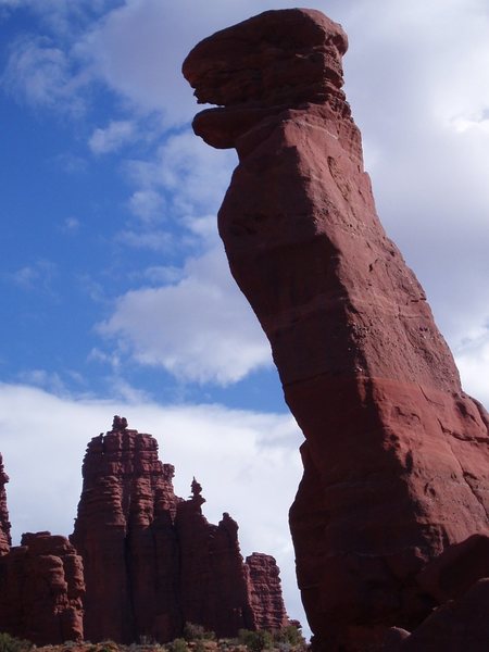 Lizard Rock with climber on the summit of the Corkscrew, Ancient Art in the background.