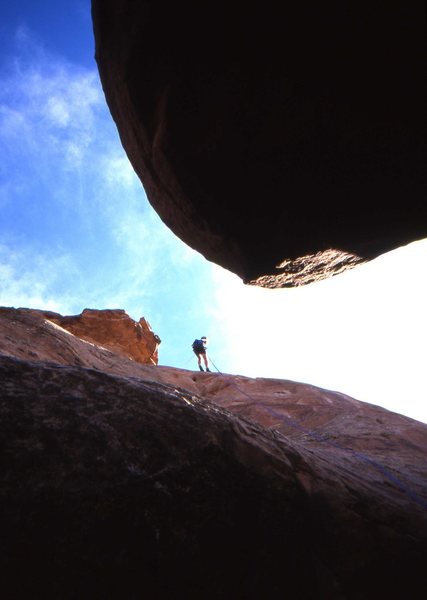 Rappeling from the summit of Independence Monument to the second belay of Otto's Route.