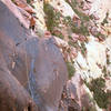 Anthony at 3rd pitch belay with the traverse into the black chimney.