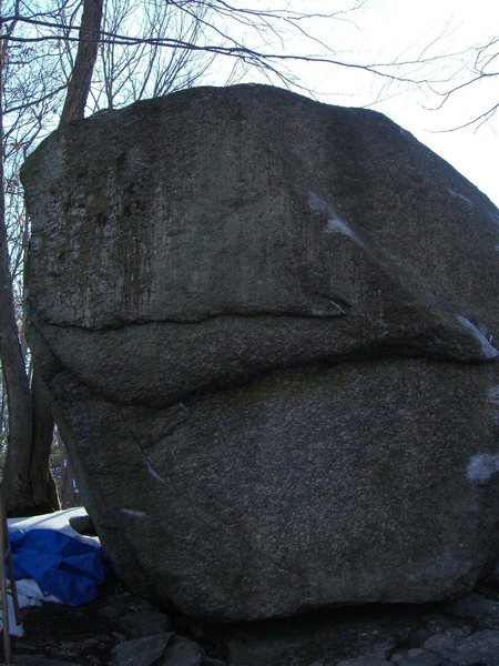 Dr. Mafesto's Revenge.  This open project climbs directly up the west face of the lemon boulder.  The sequence ends with a large left handed throw from the terribly slopey leftward rising rail to positive holds at the lip.