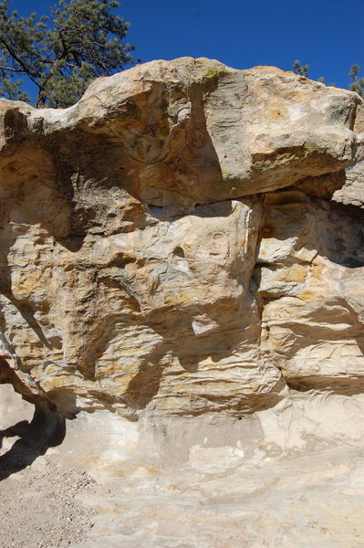 Same boulder the V3 problem is on; this picture gives a better view of the V5s on this rock.