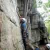 Placing gear where the pin was formerly located at the crux of Laurel (5.7)(G. Blauer photo)