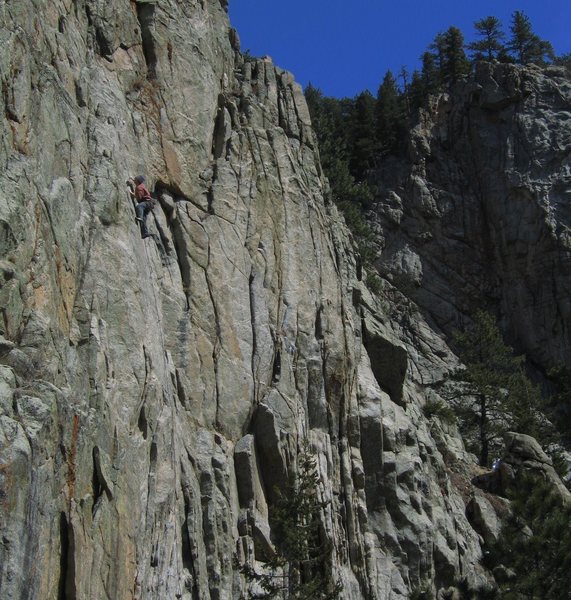 Theo moving through the upper crux on a beautiful spring day.