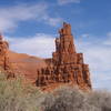 North Face of Rock Point Spire. The route climbs the thin splitter on the summit block and traverses to the right shoulder. The variation climbs the left-facing corner (left of the splitter, catching shade) to the shoulder followed by cracks on the left skyline to the summit. 