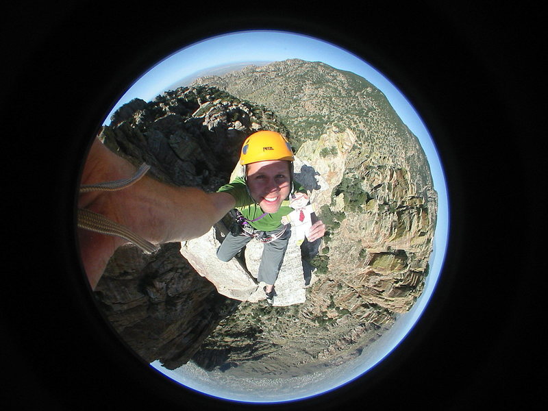 fisheye foto from finger-tip, featuring flat stanley.