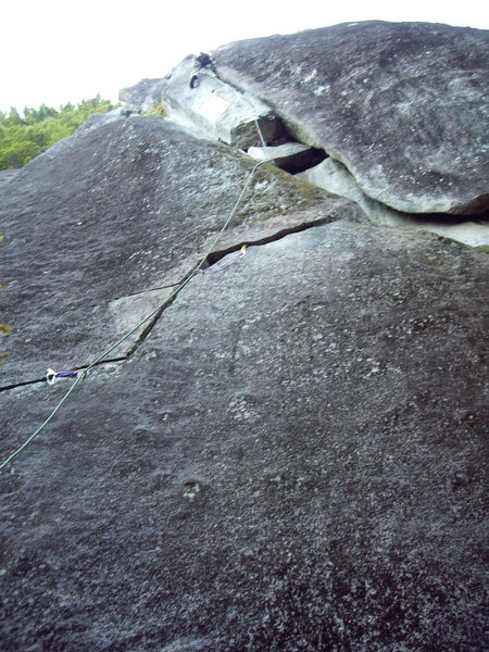 The route follows the right leaning crack up to the wide crack on the right side of the pillar.