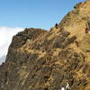 Three climbers on the sketchy traverse just before you get to the final summit scramble.