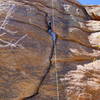 Three bolt anchor for top rope.  Laybacks and face climbing easier than jamming off-width crack. 