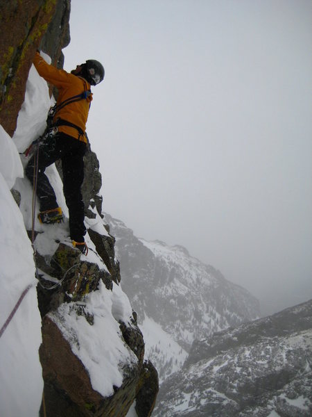 Drew Gunn standing on the 'square horn', about to move into the gully. FA attempt 4/6/08.