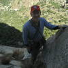 Gingerly strolling up the wall. Eric arriving at the third belay.