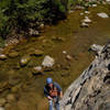 David Hoffberg demonstrates the water start, an often necessary hanging belay at the start of Pipe Cleaner. 