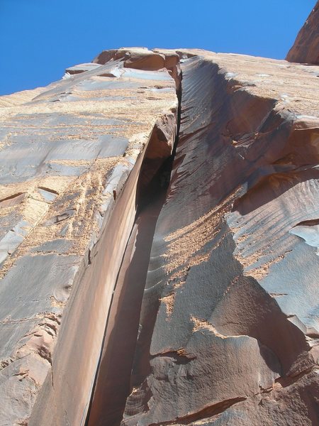 Unknown 5.10-, Tony Bubb is in the shaded chimney.  Photo taken by Dorothy.