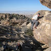 zep topping out some V2 I can't remember the name of on the eclipse boulder.