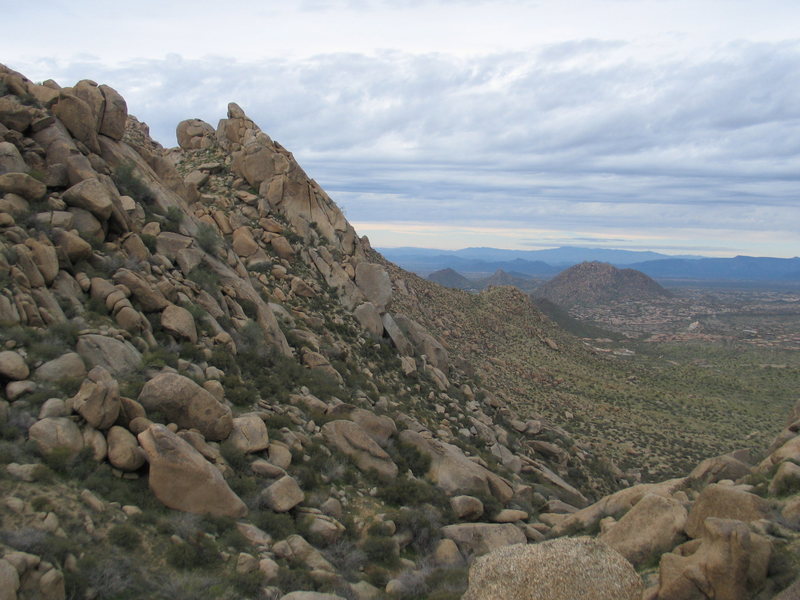 East side of the Boulder Wash trails, past the point to cross for the wall climbs and before the trail leads you back east to this ridge continuing up and behind the Wall and on to the Thumb which is out of sight in this photo.