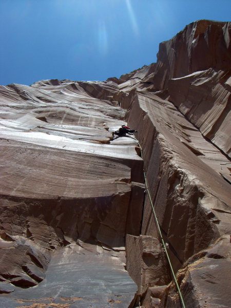 Climbing the first pitch of Get A Life on Clueless Tower. The route, Wide Load, is visible to the right. 