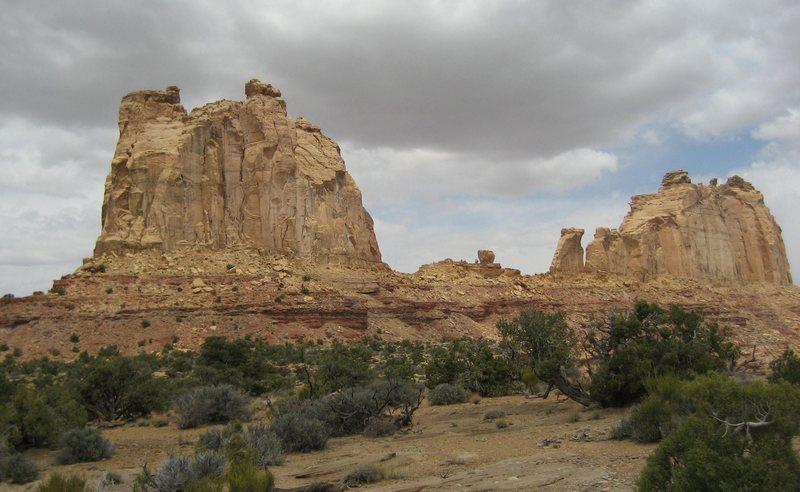 The large formation on the left is The Weasel area,about 500' at its highest point. The small 150'wave like tower in the center is Breezeway, a free 5.9.Th Big formation on the right is The Pinnacle the right end is The Pinnacle Formation,  has several routes,and two smaller towers (out of sight) at its far East end,the Belfry Tower 360' and Sodizin Tower 200'.Much of the rock here is of high quality in spite of its white appearance.The tiny block (50') in the center has been climbed by a crack on its north side at 5.10+