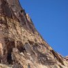 The upper climber is leading the varnished third pitch.  The circled climber is following pitch 2.