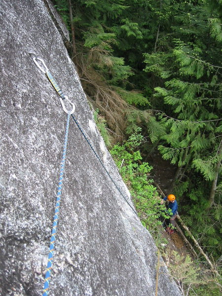 The first pitch of Borderline.  Brad was sorting a rope tangle so I got out the camera.  In the forest, the wall has a cragging atmosphere, but as soon as you're actually on the face, with the Sheriff's Badge above and views all around the Squamish Valley, it suddenly feels like a very big wall.