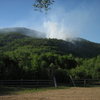 Rumney forest fire, May 28th. Main Cliff is visible underneath the smoke. The big slab on Jimmy Cliff can be seen to the left. 