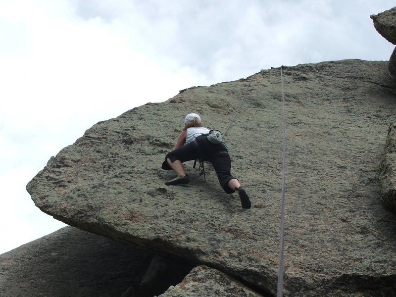 CJ on top rope after the first ascent.