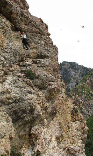 I wonder why Christian named it <em>Run for Cover</em>?<br>
<br>
(Darren Knezek cleaning off some loose rock from the second pitch on what was probably the second ascent).