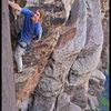 Past the roof and loving the nice splitter crack on Hot Chocolate at Winslow Wall.  Photo by Manny R.