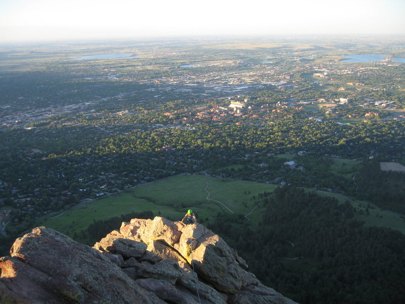 Nearing sunset, MaryKay emerges high above Boulder; Photo taken from the top of the false summit. It's a perfect time for a picnic!