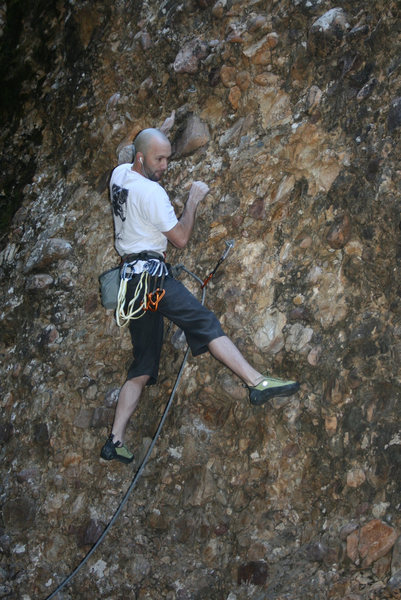 Searching for a good foot hold. Not many at the start of the climb.