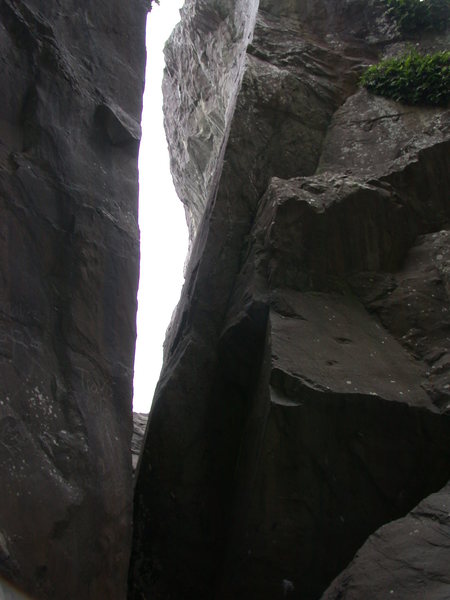 Looking west into the "slot". The Puff Boulder is on the right. The arete forming the right edge of the slot is Clicking Barnacles (5.9).