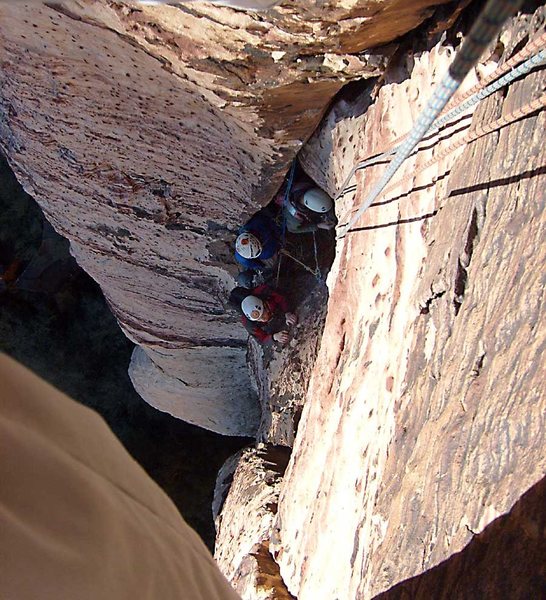 Rope tricks on pitch two.  The steady rain of small rock particles on the belay alcove persuaded our New York compatriots to pursue entertainment elsewhere.