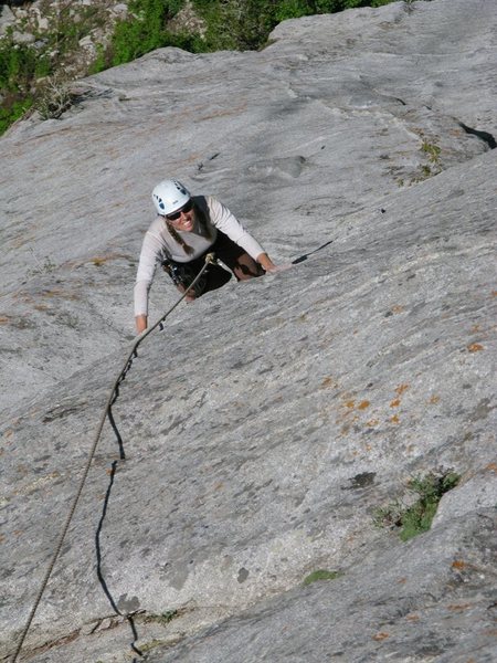 Maura Hahnenberger climbing the slab leading to the final crack on Evening Falls.