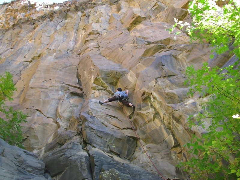 Chris on Smilin Jay (climb follows crack left of the bulge above his head)