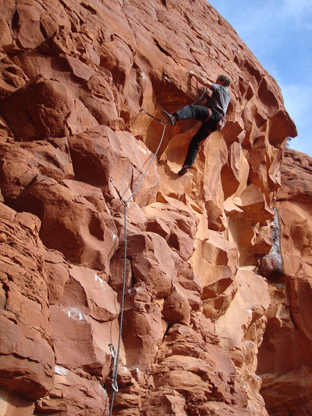 Erik Wolfe pulling the roof on the First Ascent of Sun Dogs