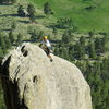 Unknown climber reaching the top of Bookmark Pinnacle. Lumpy Ridge Colorado.  June 29th 2008.  