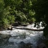 Finding a way across the river can be tricky now that the pipe is gone. Look for a log or a Tyrolean line near a pull-out at .7 miles up AF Cyn from TCNM to access [[105739659]], [[105836772]], [[105836697]], and [[106059730]].