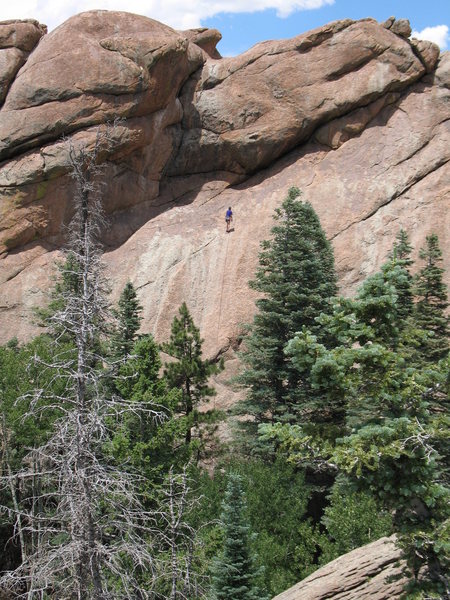 Toprope climber at the shared anchor of the Albuquerque Route (5.8+) and an Unknown route to its right (5.9+?), Middle Rock, Tres Piedras, NM.  