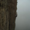 An hour later, towering in the mist, same tourist but different shirt.<br>
Photo by Mike Gura