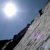 7-12-08_9:30am. Ryan about to top-out on the farthest left line on Taylor Glacier.  This climb was 45 degrees in the middle, then about 150 feet of 55 degrees finishing in another 100 feet of 60 degrees. Very fun, alpine-feeling steep finish.