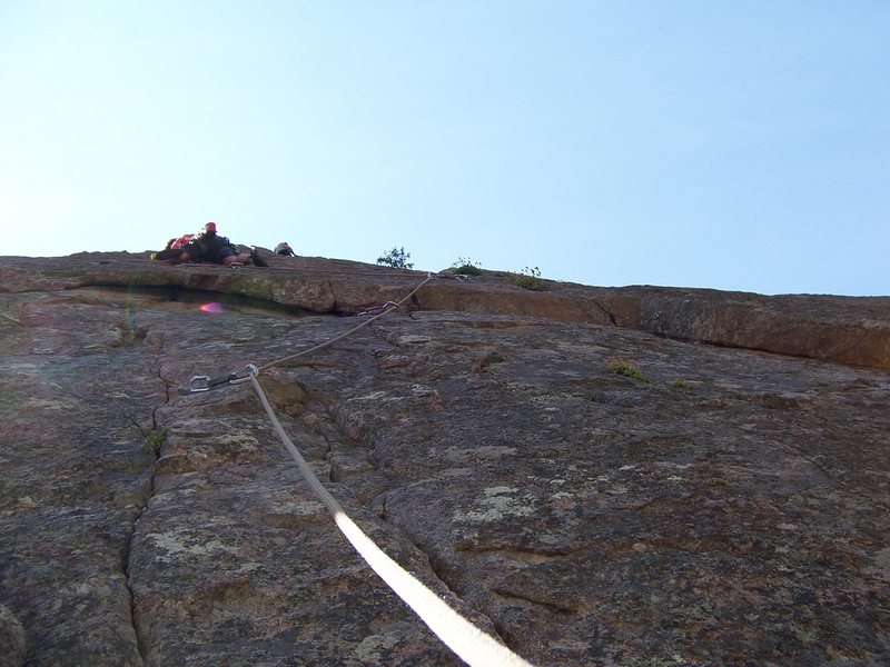 Shane Zentner on Night Vision. The route pulls the roof directly under me. However, I decided to climb the roof on the right, then move left and clip the piton. The crux is above and left of me.<br>
(PHOTO TAKEN BY RICHARD SIMMS)<br>
