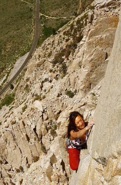 Elizabeth passing around the crux on p-2, 'West Face'