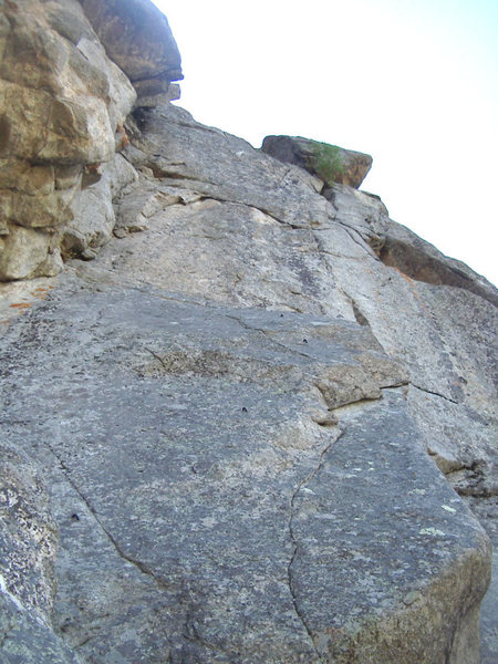 Pitch 3 (crux) of Naked Lunch, with the fun roof on Pitch 4 on the skyline. 