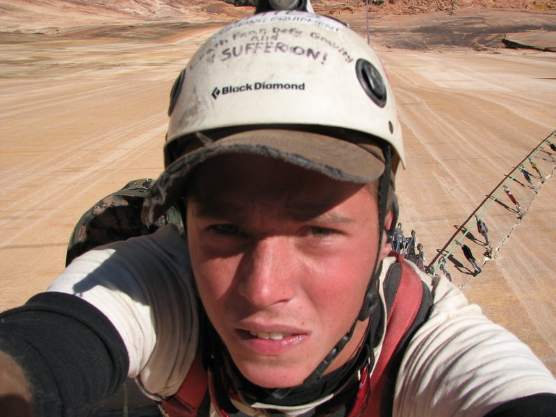 Big air on the first solo of the sugar cookie: Latitudes-Streaked Wall, Zion Ut.