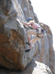 Rebecca Manley working the slightly awkward move onto the face half way up Suzie's Wild Ride.