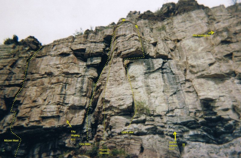 Note the huge perched death block lodged in the crack under the roof...a bolt helped bypass this on the FA. First Mate climbs the black slot on the left to ledge and the face above....