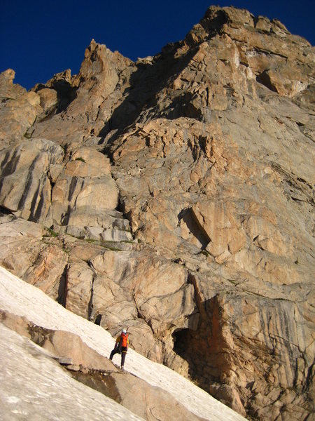 The approach snowfield and 4th-Class start. 8-1-08. The Ramp is shadowed, and edge on to the image.