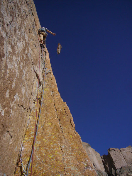 Moments earlier I ripped off a huge flake and took a 20 footer onto a 00 TCU!  Oye.  After climbing back up we trundled this, the remainder of the flake.  The direct start to the Yellow Wall (5.11b R).  Photo by Rob Dillon.